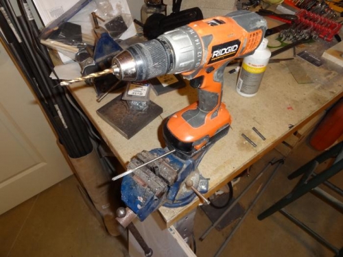 Drilling and reaming the trim tab hinge