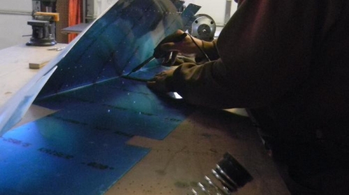 using the soldering iron to trim blue plastic