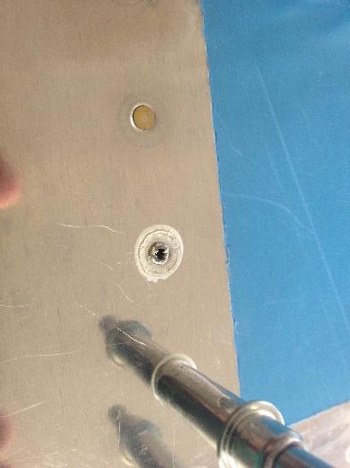 The rivet hole befor I clean the Scotchweld out