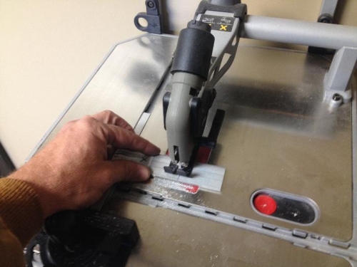 Used this handy wall mount table jig saw with metal blace to cut the tie down spacers to size