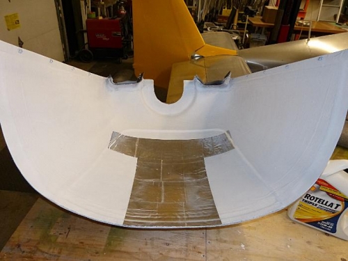 Heat shield material applied to cowling