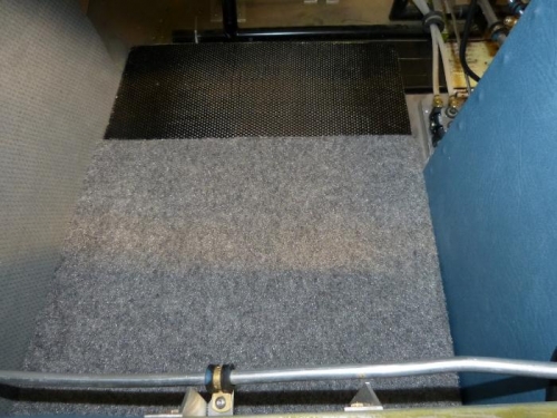 Floor panel installed over the filler panels and covered with carpet. CF wear panel .