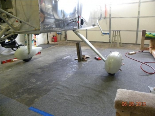 Tail of Airplane supporting plane level & wheels barely touching