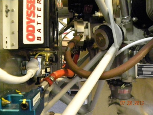 orange fuel line routing from gascolator to fuel pump.  Can see carb installed on bottom.