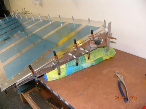 Bottom attach strips fastened in place for Drilling