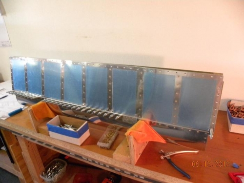 Aileron in Jig - Riveting leading edge to spar