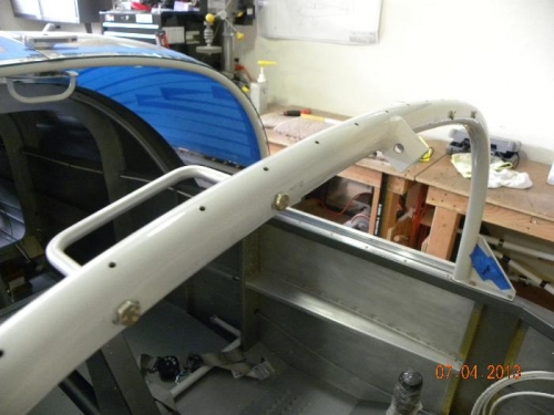 AN3-4a bolts fasten through roll bar and into threaded aluminum