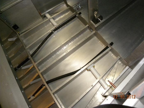 Cleaned area below baggage floor and document conduit routing