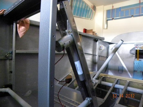 flap motor nestled into the aft side of its bracket