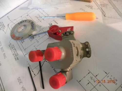 Andair fuel selector disassembled and nutplates riveted on fastener holes.