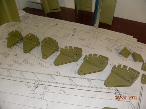 flap hinge bracket assemblies riveted together