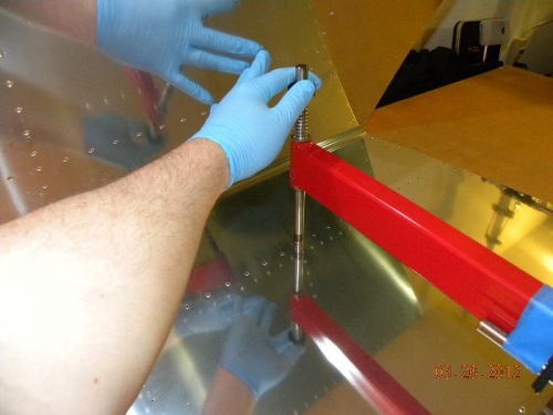 I like to hold the post against the sheet while smacking it.