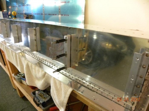 Riveting nut plates to the rear tank baffles