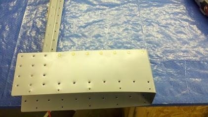 Counterbalance skin riveted onto the counterbalance rib.