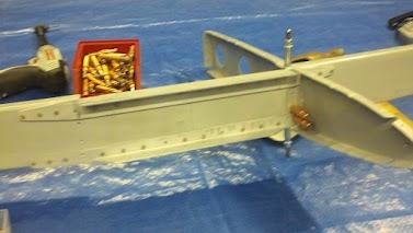 Front spar reinforcement angles riveted on