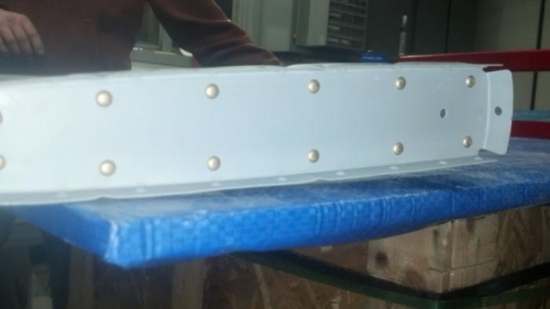 Outboard ribs riveted together