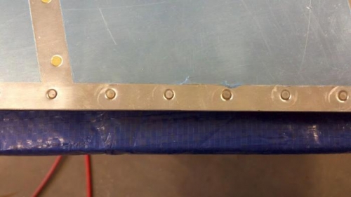 This is what the rivet tail side looks like when flush riveted down into the dimpled skin.