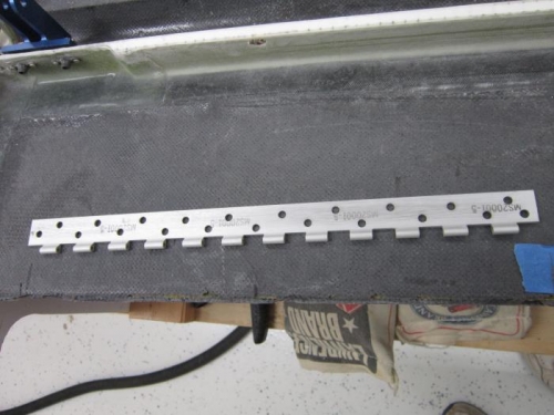 Trim tab half with holes for flox
