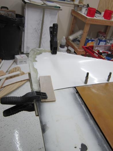 Wing tip re-assembled with longer trailing edge, curing