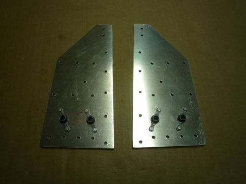 Roll bar attach plates with nutplates riveted