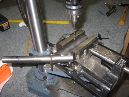 Drilling pilot holes in axel assemblies