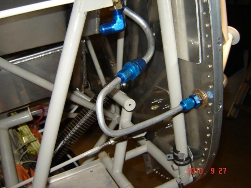 Fuel line through firewall