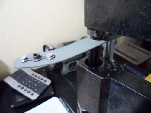 Riveting nutplates to retaining strip