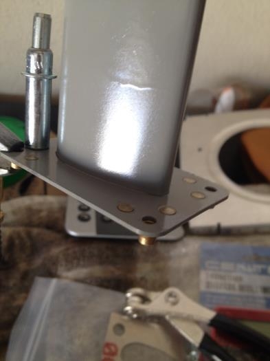 Riveting nutplates on steel mast