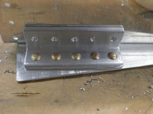 Riveted lower portion of angle