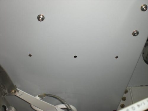 Holes for securing tie down panel