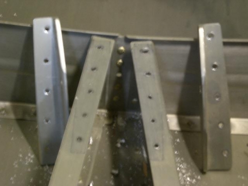 Factory elevator bellcrank brackets removed