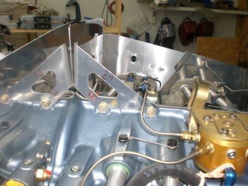 Brackets installed on front and rear of engine