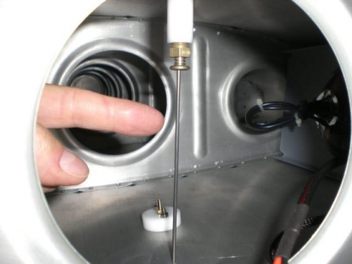 Hole drilled for drain tool access