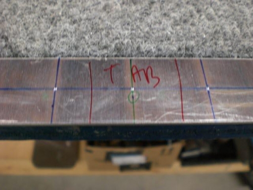 Cap center punched and tab marked