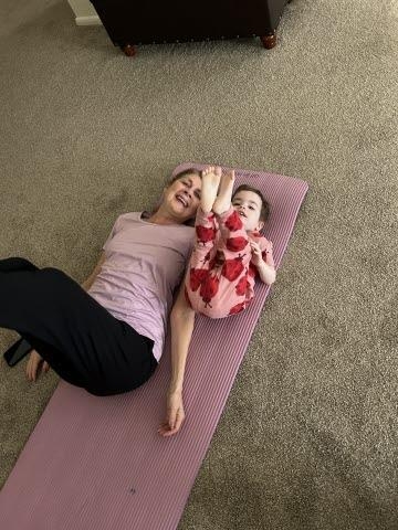 Evie loved to do stretches with Grandma