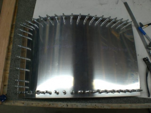 Baggage door skin drilled