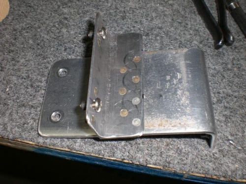 Bracket made and riveted