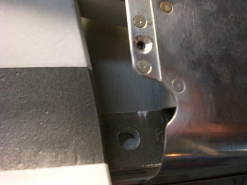 Positioning the wear bracket and making clearance for bolt