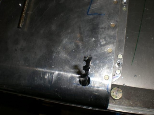 Holes through skin for drilling rear holes