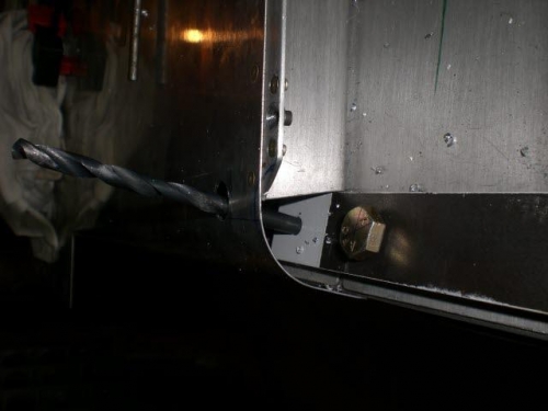 Hole is angled due to bend, interferring bracket