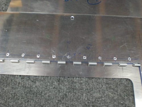 Inboard hinge hole drilled