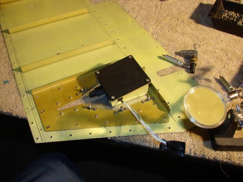 Installed cover plate and servo