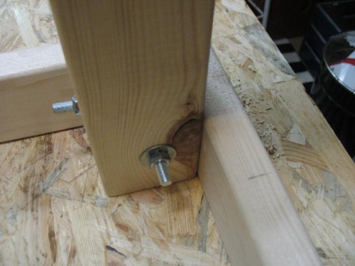 Leg of the work bech bolted to the frame