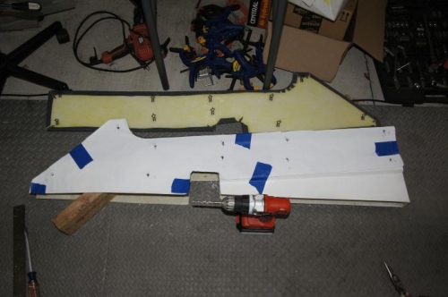 Using a template to drill side cover clip holes.