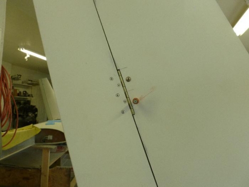 One on each hinge then the other