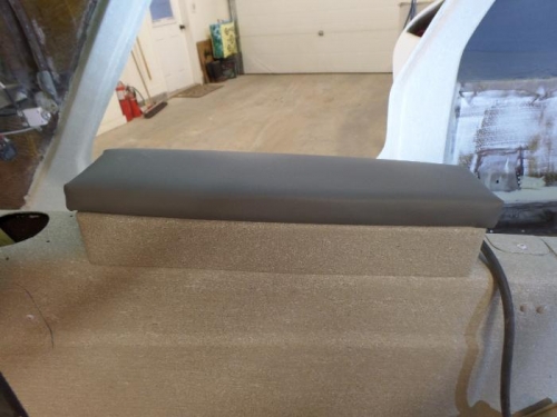 Cynthia’s sewing on armrest.