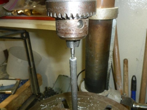 Drill press lath. Tap in hole.