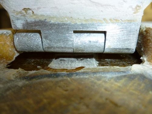 Wedge in place to hold hinge up