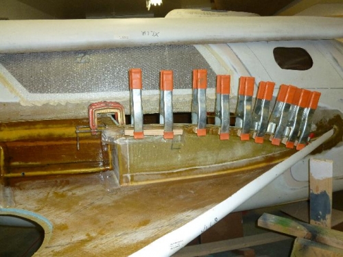 Flange on baggage bulkhead