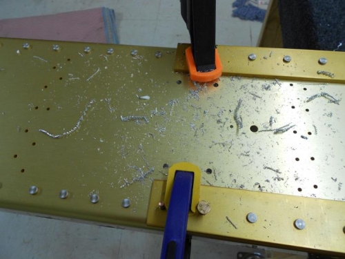 Using predrilled holes in spar as a guide